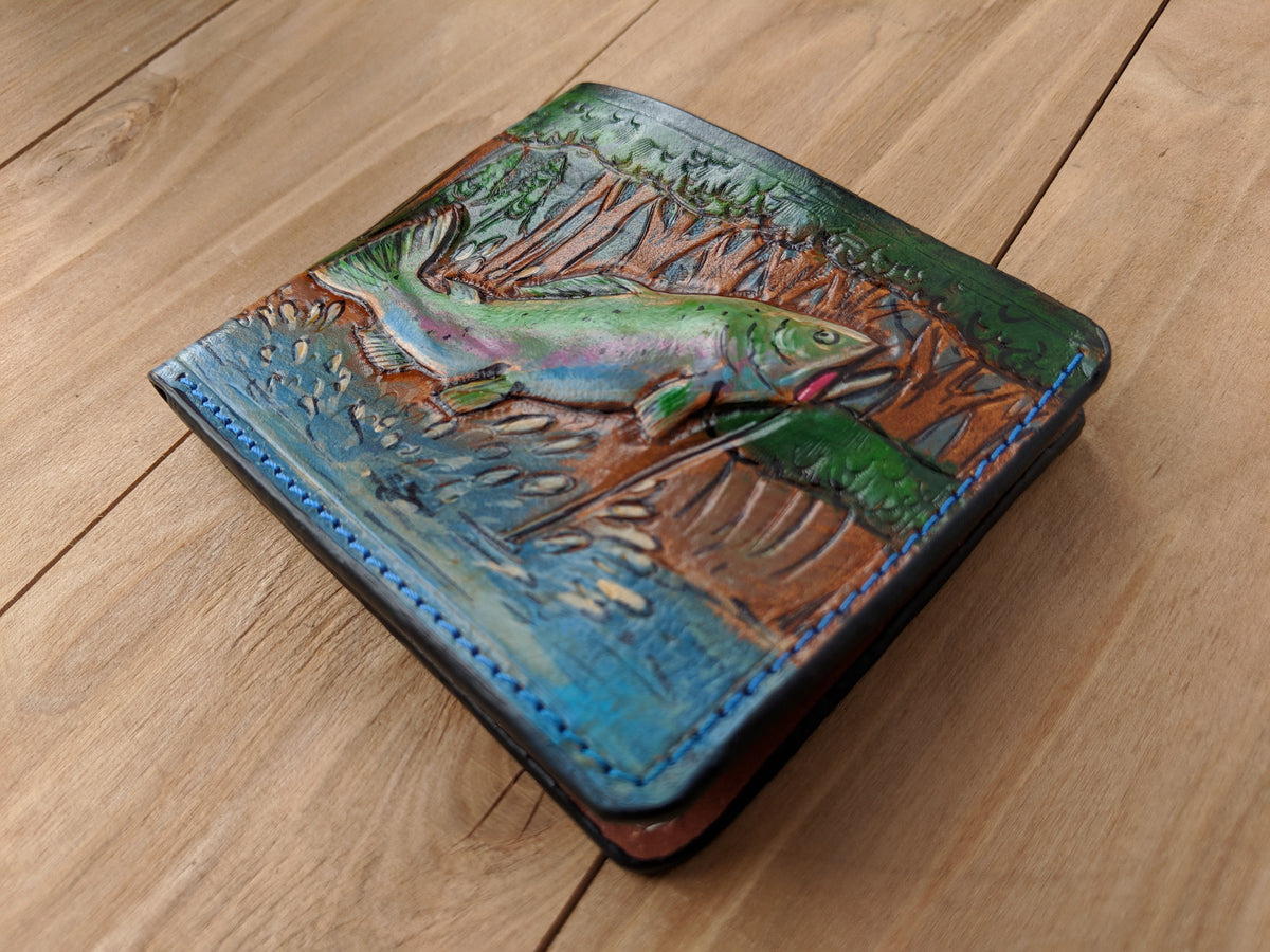 Handmade leather bifold wallet with carved bass fishing design, perfect gift for outdoor enthusiasts