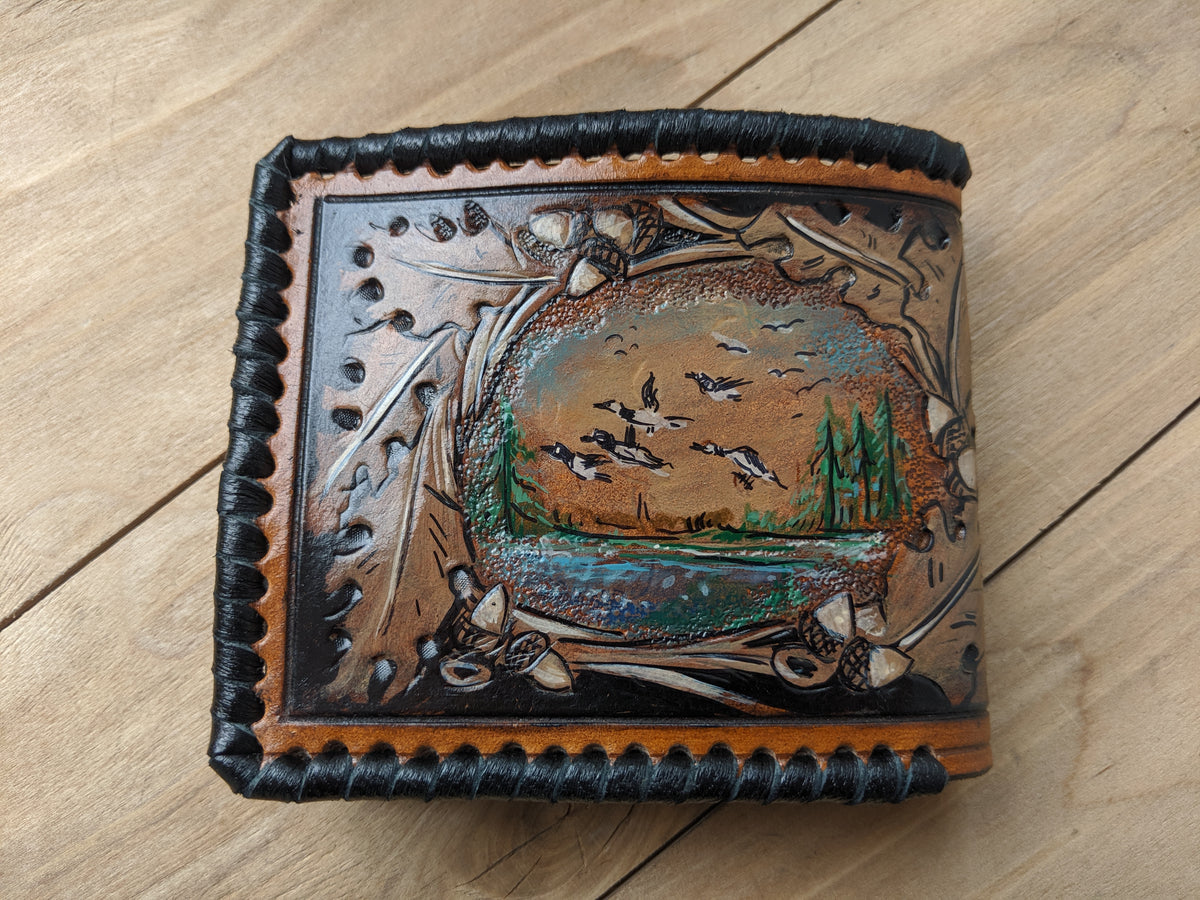 Handcrafted leather bifold wallet with carved duck hunting design, perfect gift for Father's Day