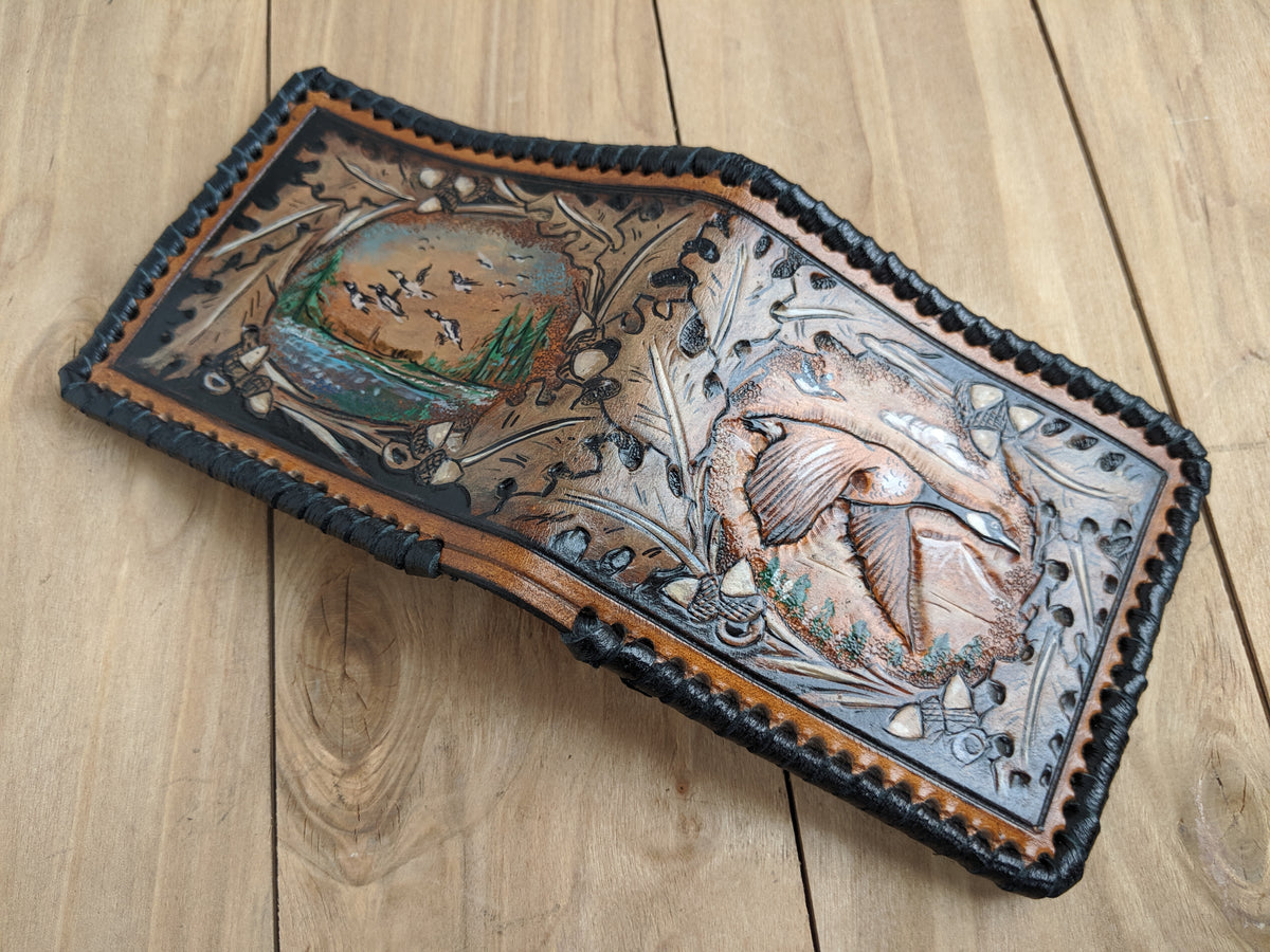 Handmade leather bifold wallet with embossed goose hunting design, perfect gift for hunters and outdoorsmen