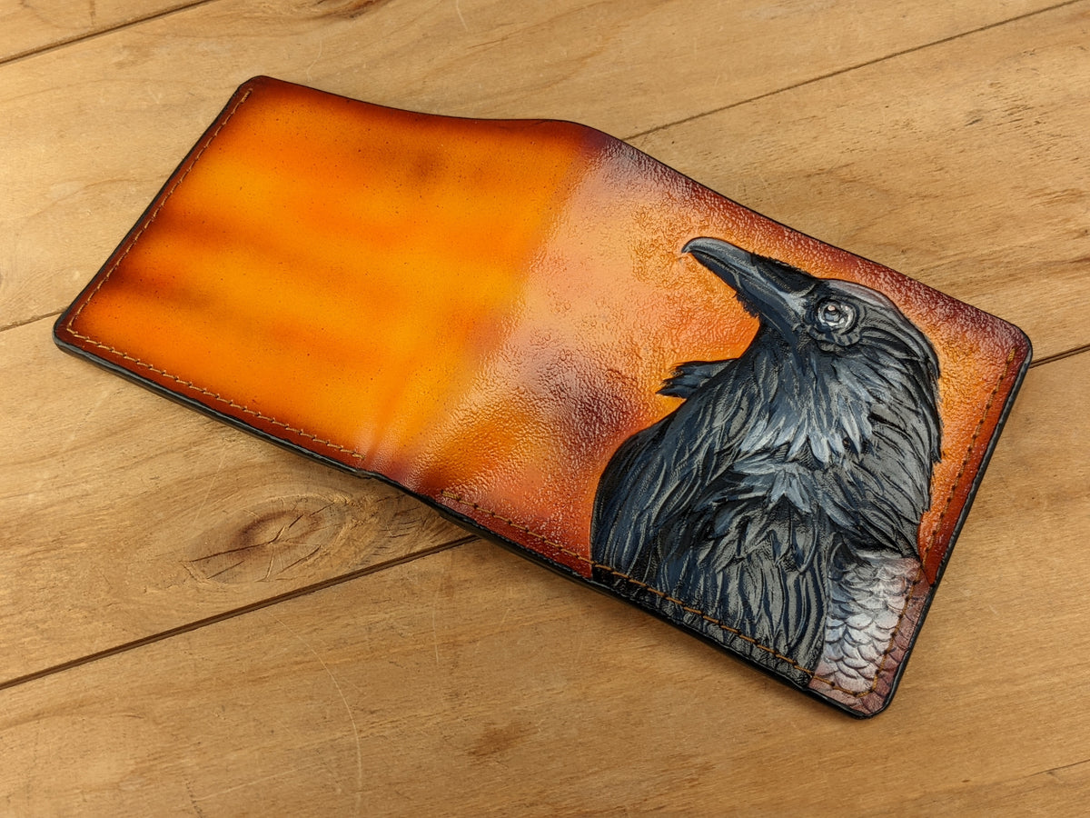 Handmade leather bifold wallet with carved Odin raven design, perfect gift for men and Viking fans