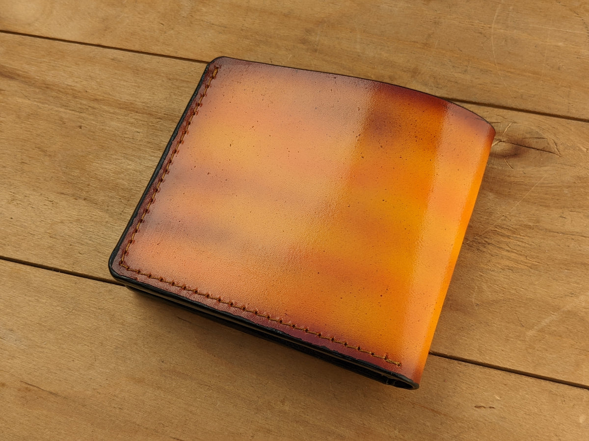 Handmade leather bifold wallet with tooled Odin raven design, perfect gift for men and Viking lovers