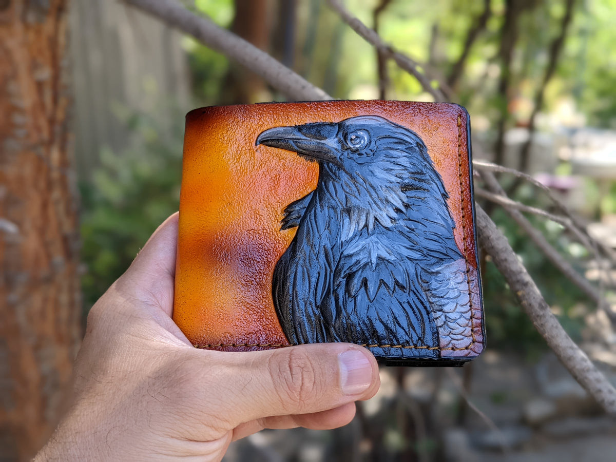 Handmade leather bifold wallet with embossed Odin raven design, perfect gift for men and Viking fans