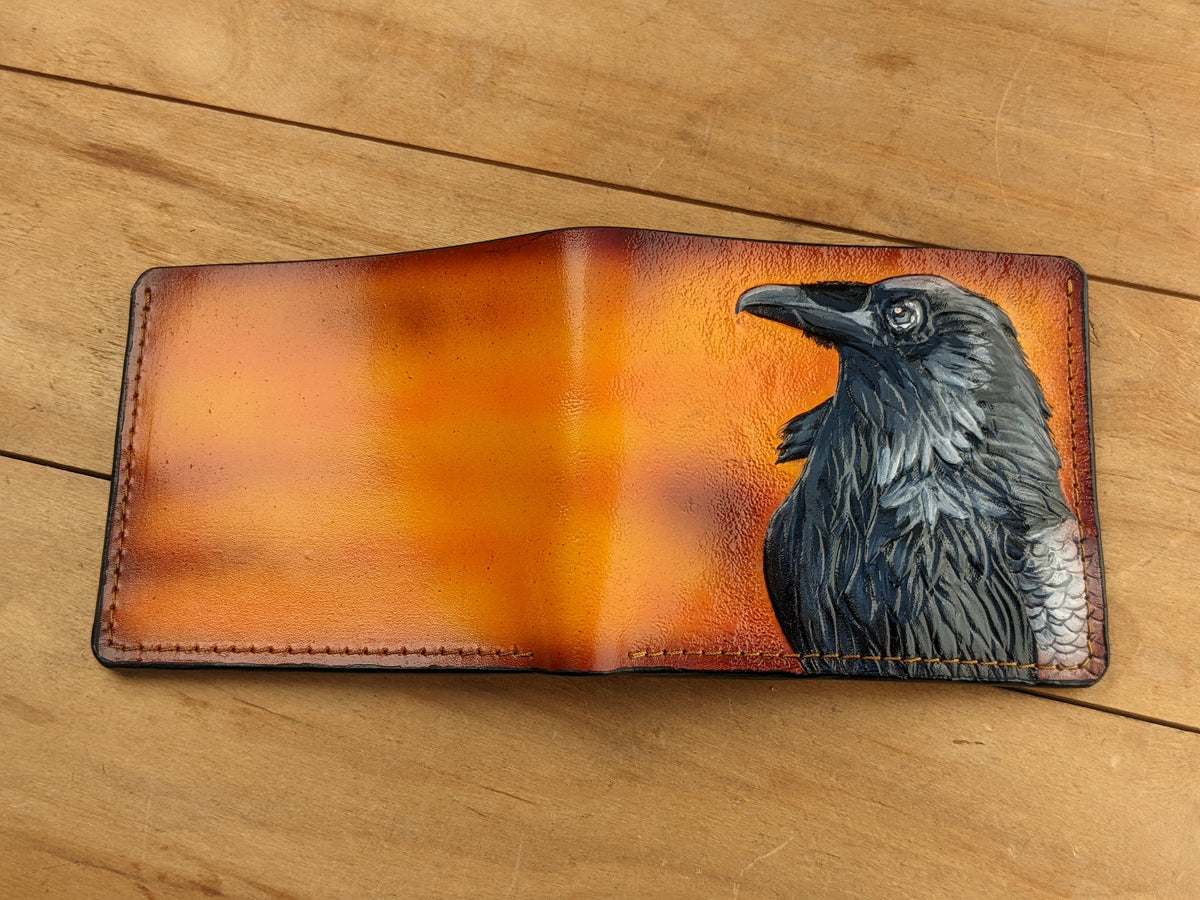 Handmade leather bifold wallet with painted Odin raven design, perfect gift for men and Viking lovers