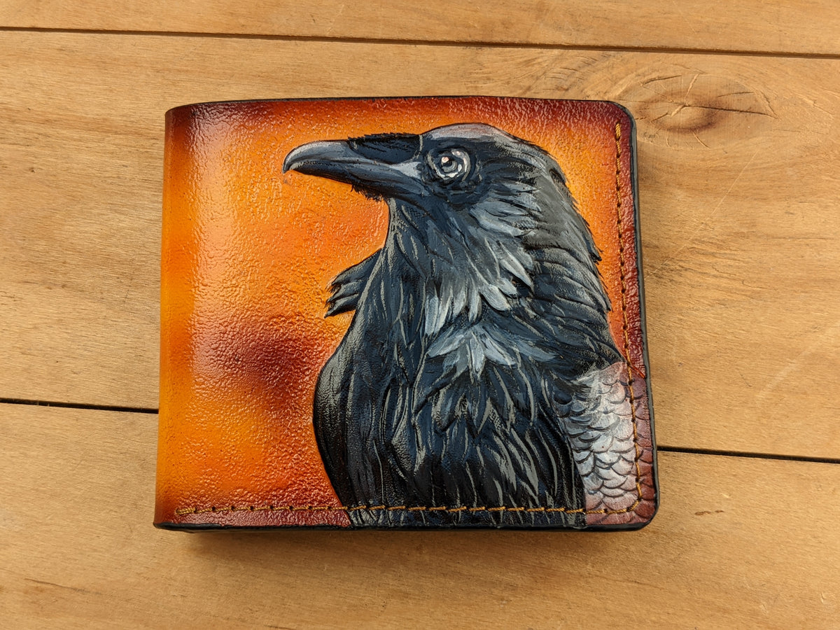Handmade celtic leather bifold wallet with carved Odin raven design, perfect gift for Viking fans