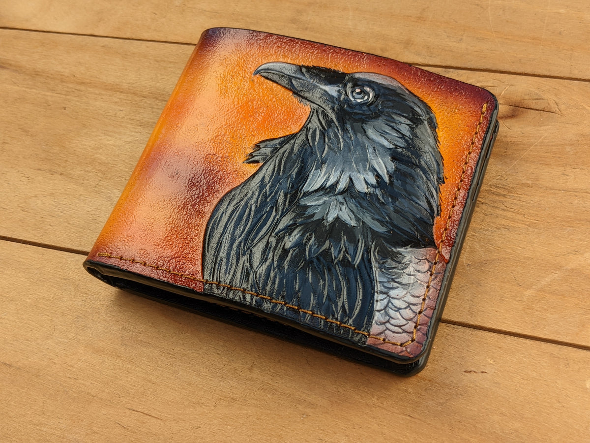 Handmade leather bifold wallet with embossed Odin raven design, inspired by Norse mythology