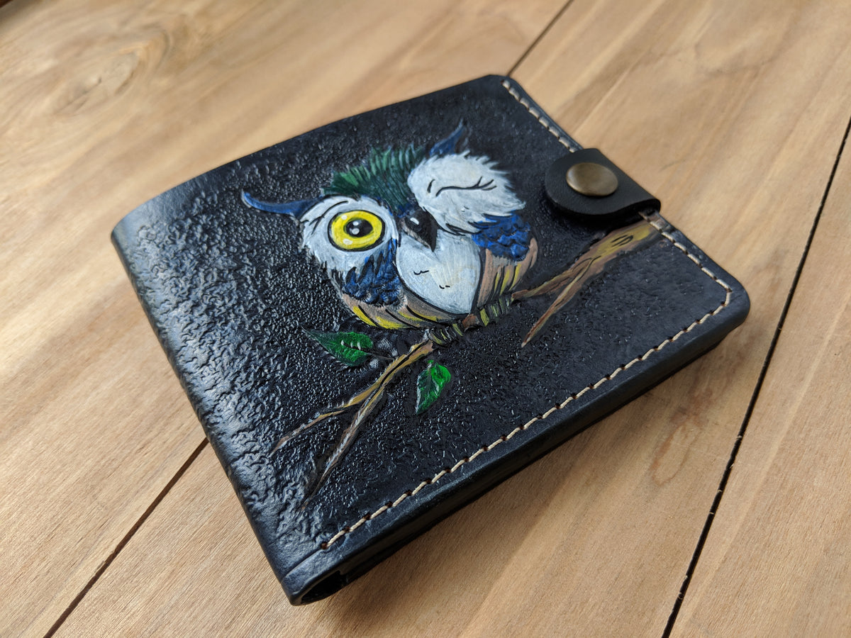 Handmade leather bifold wallet with carved cartoon owl design, festive chouette motif, perfect Christmas gift