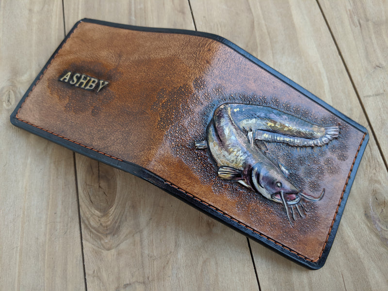 Handmade leather bifold wallet with carved catfish design, perfect gift for fishermen and anglers