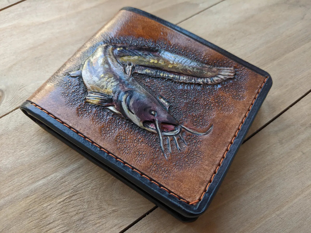 Embossed bifold leather wallet featuring catfish design