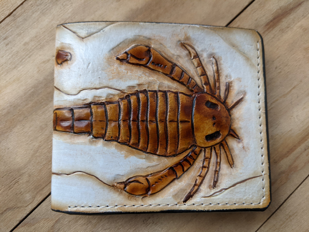 Handmade leather bifold wallet with embossed Eurypterid sea scorpion fossil design, perfect men's gift