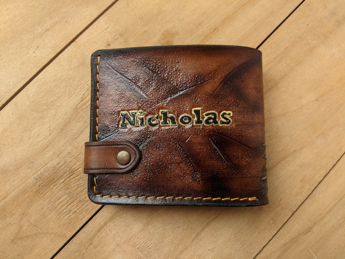 Handmade leather bifold wallet with carved grizzly bear, perfect gift for bikers and bear lovers