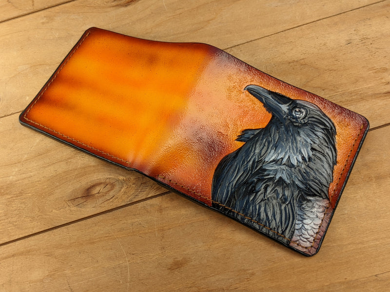 Handmade leather bifold wallet with carved Odin raven design, perfect gift for men and Viking fans