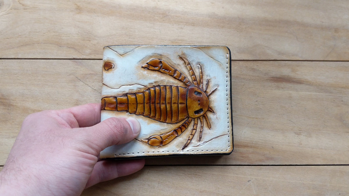 Handmade leather bifold wallet with embossed Eurypterid sea scorpion fossil design, perfect men's gift